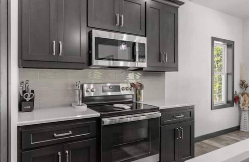 Jacksonport House | New, charming custom home, 7 minute walk to the beach