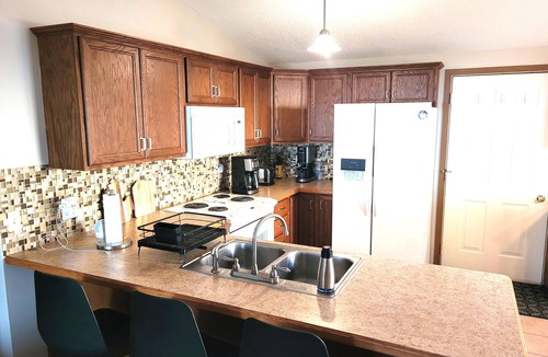 Au Gres House | New! Huron Paradise - Cute and Family-Friendly Lakefront Home with Pirvate Sandy Beach, Beach Bonfire Ring, and Kayaks!