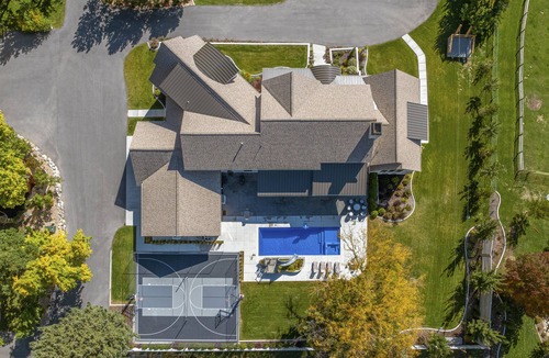 Mapleton House | New resort-style vacation property with ponds, pool, sport court and theater