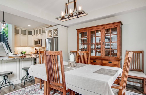 Eagle River Condo | Newly-built condo on Duck Lake with decks, private dock, & firepit