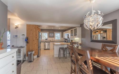 Yellowknife House | NHP YK B&B - Large Deck- Hot Tub - Massage chair and seasonal swimming pool- Free parking - Pet friendly