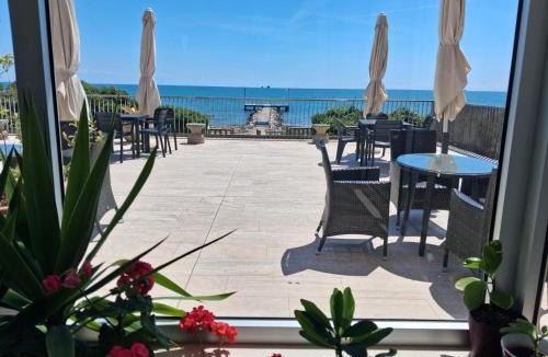 Santa Maria in Stelle Apartment | Nice flat on the beach front with private beach spot included