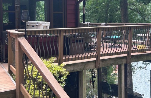 Livingston House | "No Wake Zone" with large dock, covered slip, and diving platform.