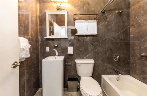 Whitby Hotel | Ocean Breeze Resort - 2-bedroom Hotel Suites, Pool, Gym and Restaurant