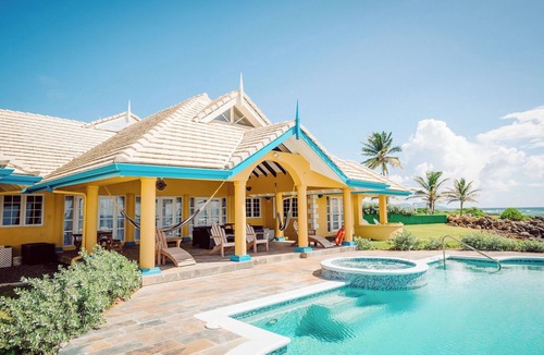 Lowlands Villa | Ocean front luxury villa in gated golf course community with private beach.