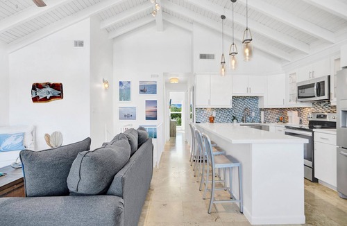 Rock Harbor House | Ocean Front Villa with endless Views, golf cart, paddle boards, kayak and bikes