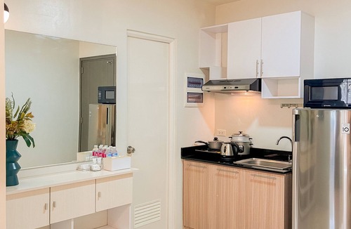 Puerto Princesa City Centre Apartment | Ocean Studio1 Bedroom, Private Balcony, Inviting Pool, and Gym