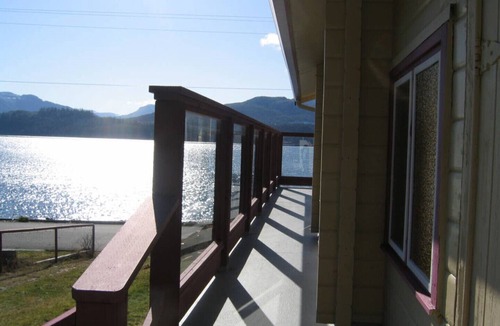 Alert Bay Bed & Breakfast | Ocean View Log Lodge with queen bed. Hot breakfast included.