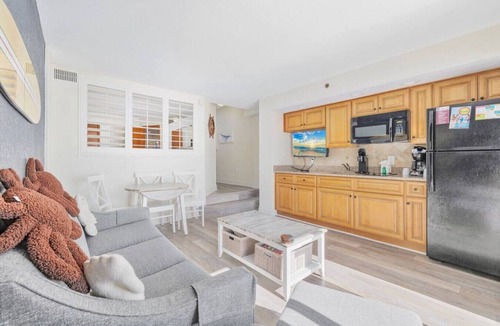 Windy Hill Condo | Oceanfront Condo Balcony with Resort Pool Hot Tub