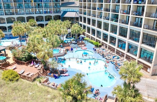 Windy Hill Condo | Oceanfront Condo Balcony with Resort Pool Hot Tub
