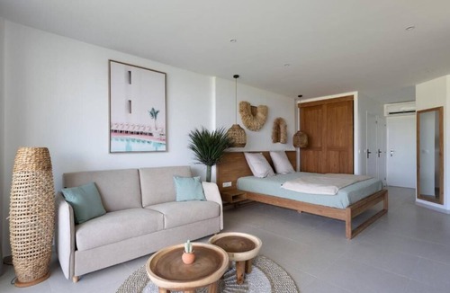 Anse Marcel Hotel | Oceanfront Comfort: Relax in a Roomy Suite with Kitchen Overlooking Anse Marcel