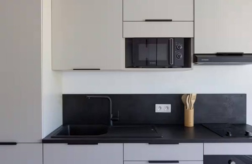 Anse Marcel Hotel | Oceanfront Comfort: Relax in a Roomy Suite with Kitchen Overlooking Anse Marcel