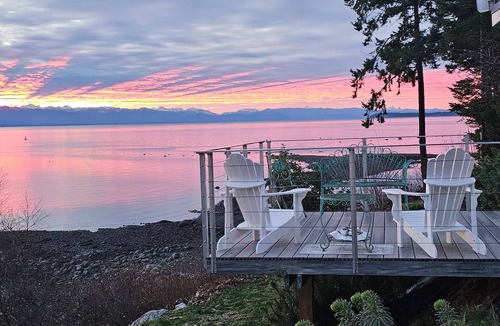 Sliammon House | Oceanfront Getaway: Sunsets, Sauna & Hot Tub w 180 views. Tropical Garden Oasis.