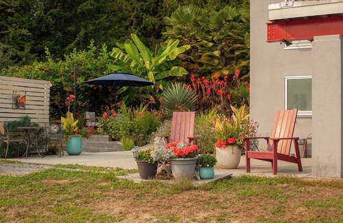 Sliammon House | Oceanfront Getaway: Sunsets, Sauna & Hot Tub w 180 views. Tropical Garden Oasis.