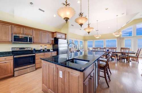 Ocean Isle Estates House | Oceanfront Home with Hot Tub, Pool, Putting Green, Elevator, and Game Room