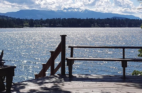 Beachcomber Cabin | Oceanfront log cabin with sweeping ocean, mountain and sunset vistas