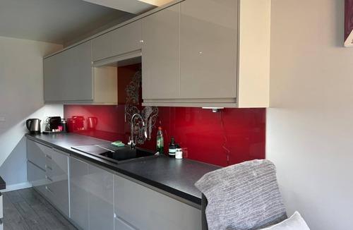 Lychpit House | Old Basing Retreat is a sleek 3 bedroom, 2 bathroom home in historic village.