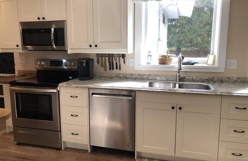 Clam River Cottage | ON TORCH LAKE - SUNSETS - LG SANDY BEACH & YARD - PERFECT FOR FAMILIES BOOK 2027