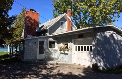 Clam River Cottage | ON TORCH LAKE - SUNSETS - LG SANDY BEACH & YARD - PERFECT FOR FAMILIES BOOK 2027
