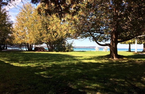 Clam River Cottage | ON TORCH LAKE - SUNSETS - LG SANDY BEACH & YARD - PERFECT FOR FAMILIES BOOK 2027