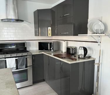 Cos Cob Apartment | One bedroom with modern kitchen, balcony with water view