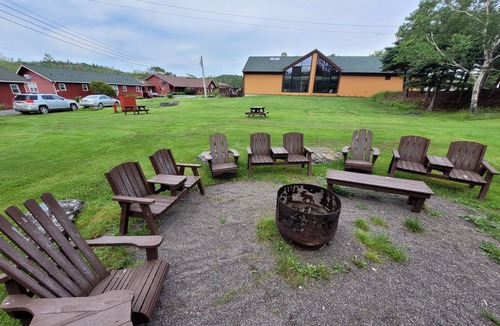 Liscomb Cabin | One Room Cabin with a double bed and small table with two chairs