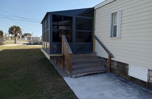 Sebastian House | Open and inviting home with screened in porch.