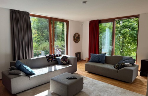 Titschendorf Apartment | Open-plan vacation home with large panoramic windows and sauna