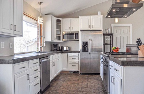 Martin Acres House | Our comfortable home, with great view of the Flatiron Mountains, sits in the heart of South Boulder. Enjoy the private hot tub spa, media room with 84" Theater TV, well stocked Chef's kitchen. Walk to shopping, restaurants, brewery and trails nearby.