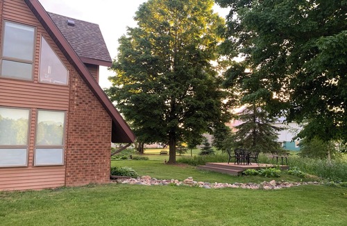 Oneida House | Our Thunder Moon Farm Stay- sleeps 7, framed by wildflowers. 4 miles to GB.