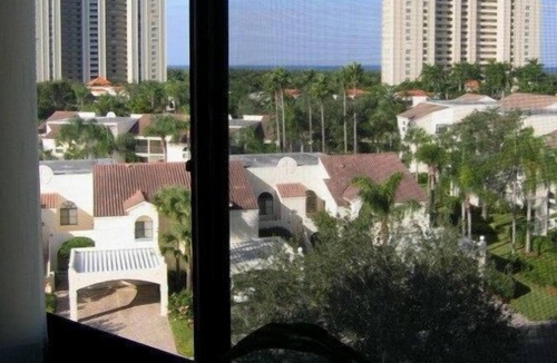 Pelican Bay Condo | OUTSTANDING LOCATION. End Unit Top Floor Condo near Beach, favored Pelican Bay