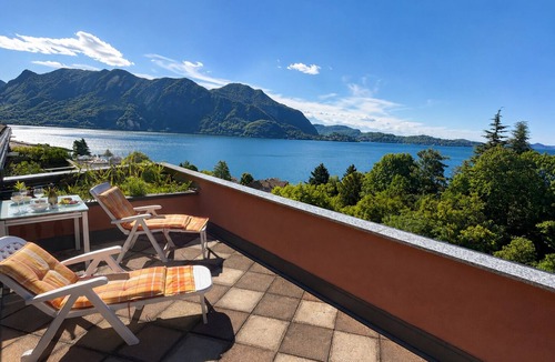 Susello Apartment | Panorama studio with 40 m² sunny balcony, pool & fantastic view of Lake Maggiore