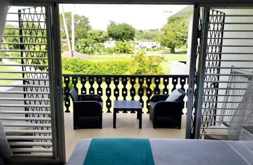 Rendezvous Apartment | Peaceful intensely clean unit overlooking tropical gardens and golf course