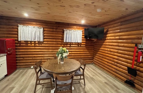 Kimbolton Cabin | Peaceful log cabin on a back gravel road with private deck and amenities of home