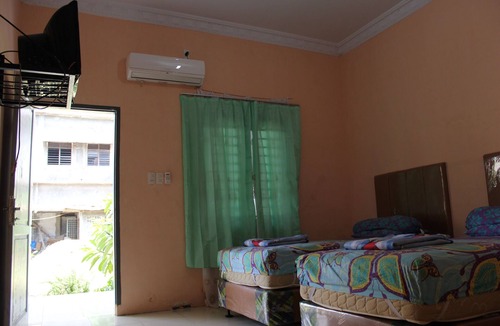 Medan House | Penginapan Transit Tomato