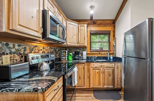 Union Hall Cabin | Perched privately on a bluff with breathtaking sunrise views over Smith Mountain Lake, this cozy remodeled 2BR/1BA log cabin offers queen memory-foam beds, well-stocked granite kitchen (farm-fresh eggs!), covered deck, stone fire pit, huge dock.