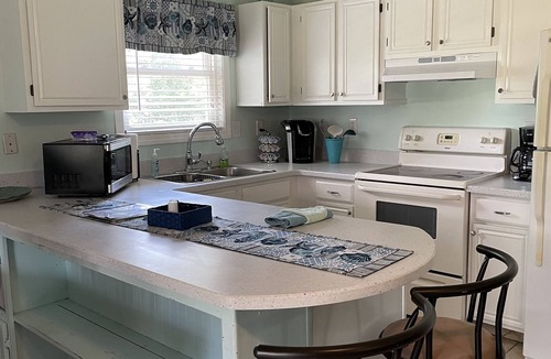 Colington House | Pet friendly 3 Bed/2 Bath Soundside retreat in OBX with Hot Tub & Enclosed yard