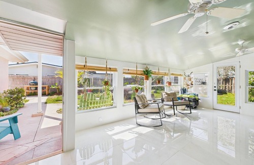 Surfside Estates House | Pet-friendly 3BR beachside home with fenced yard, hot tub, Green Egg grill, and beach gear! Walk to the ocean and relax in your private coastal backyard oasis.