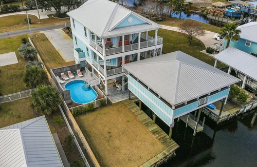 Cotton Bayou House | Pet Friendly, Boaters Paradise, 2 Boat Slips, Covered Outdoor Kitchen & Pool