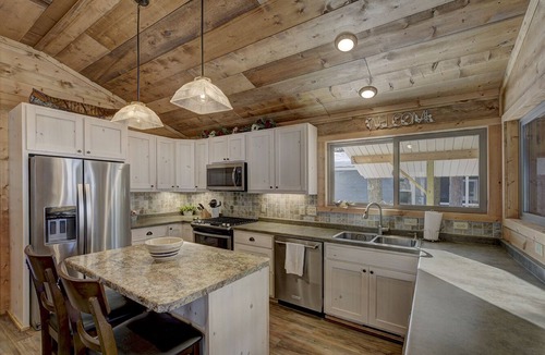 Eagle River Cottage | Pet Friendly Lakefront Cottage on Crystal Clear Private Meta Lake!