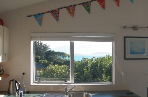 Tata Beach House | Pet friendly yard, great Sea Views and just across the road from Tata Beach