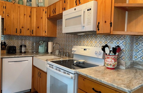 Penn Lake Park House | Pocono Lakefront Home- with Private Dock & Swim Raft, Fire Pit, & Boats!