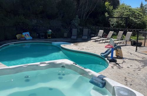 Vernon Apartment | 🌴 Pool + Hot Tub Modern 2BR Retreat Near Trails & Orchards