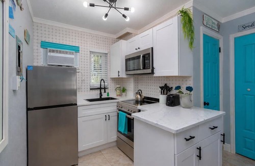 Treasure Island Condo | 🌴Poolside Studio @ Tropic Terrace | Ground Floor Steps to Beach King Bed ➠ TT10