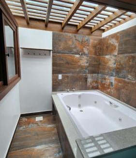 Sambaqui House | Pousada Águas de Ibiraquera Suíte Ribanceira