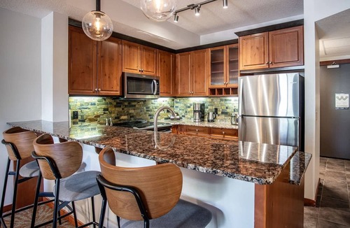 Canmore Condo | Premium King suite with views and pool