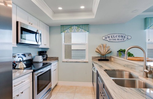 Punta Rassa Condo | Pristine Waterfront Residence with Panoramic Water Views - Pool Open!