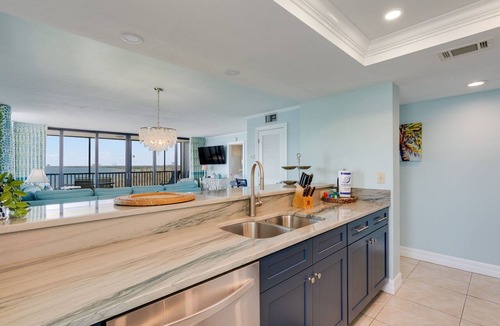 Punta Rassa Condo | Pristine Waterfront Residence with Panoramic Water Views - Pool Open!