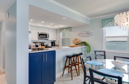 Punta Rassa Condo | Pristine Waterfront Residence with Panoramic Water Views - Pool Open!