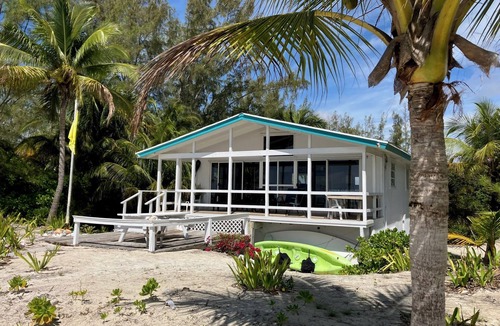 Bahama Palm Shores Cottage | Private Beach House on Casuarina Bonefish Beach with Motorboat for Rent